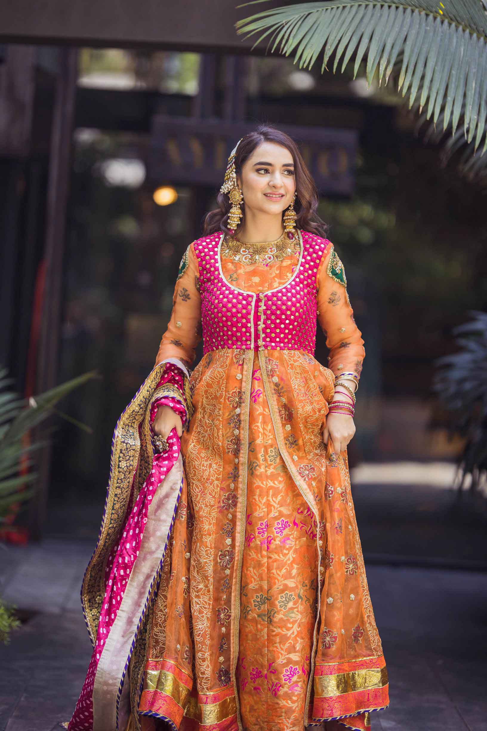 Chest of indian pakistani bride wear inlaid yellow festive dress and  massive golden necklace close up during henna mehndi sangeet ladies party  night Stock Photo | Adobe Stock